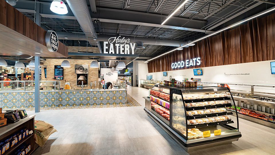 A variety of fresh food service points greets customers at entry, delighting all the senses.