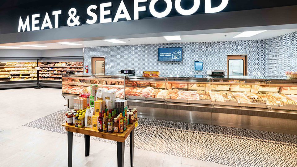 Encaustic Mexican tiles and internally illuminated signage highlight the service offering and attracts the customers further back into the store.