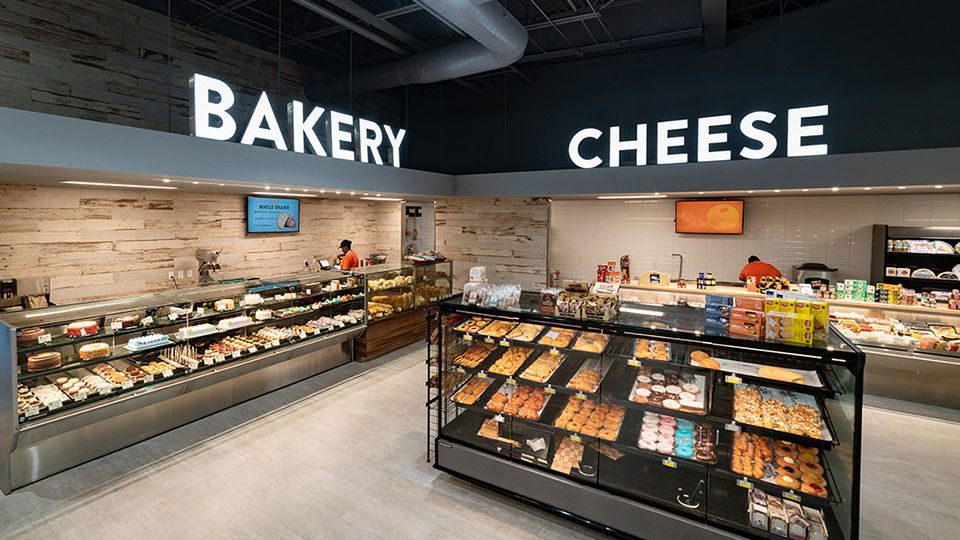 Distressed wood-like porcelain Italian tiles anchor the Bakery experience creating a focal point for customers and elevates the experience. Integrated digital screens are used throughout the store to inform, engage and celebrate everything food with customers.