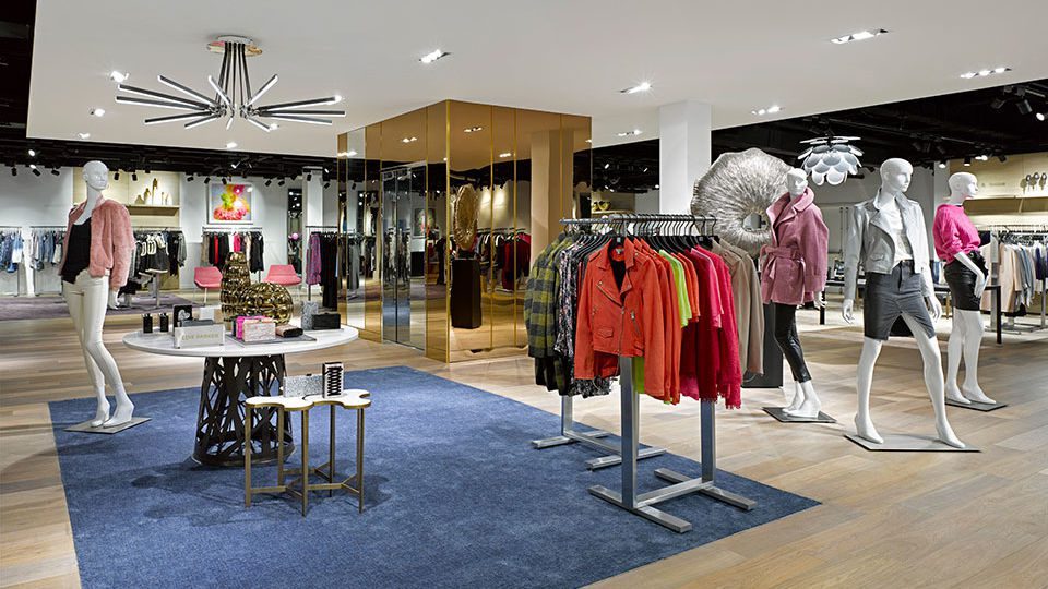 Grand architectural gestures are seen throughout the store with large-scale ceiling sculptures and artistically staged spaces with curated objects,