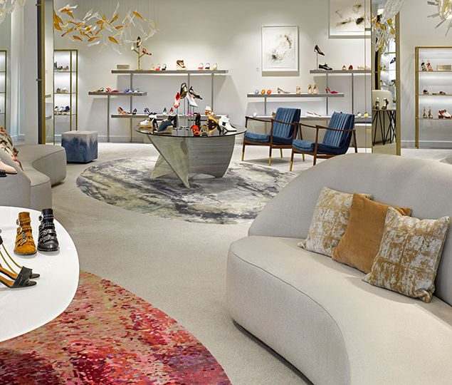 10022 Shoe celebrates the four seasons with sculptural elements, and strategic color choices to evoke the feelings of home. Seasonal locality is seen throughout the store with a hint of the iconic local color of spring, the cherry blossom, expressed in the area rugs and lounge, while an ice blue hue inspired by the color of the winter ocean is used in the furniture fabric in the lounge