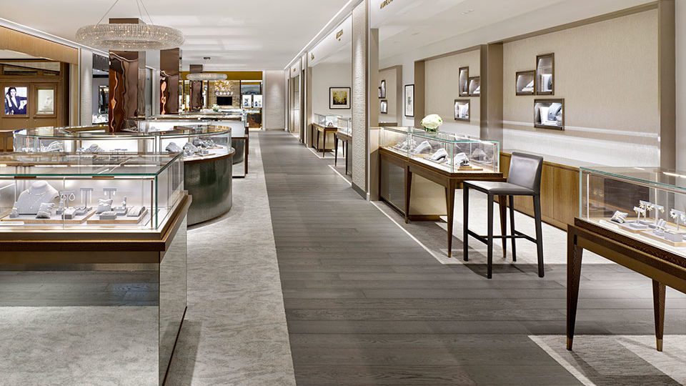 Created as a boutique, The Vault offers high-end jewelry for multiple brands within shop-in-shop environments as well as a traditional sales floor. The space highlights the balance between warm and cool tones with champagne metals and rich wood paired with crisp white monochromatic architectural elements and neutral carpet tones.
