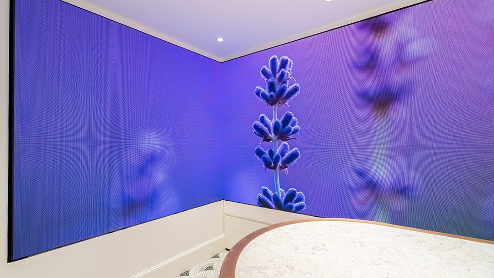 A tasting bar sits at the end of the store is surrounded by large-scale digital screens that act as an immersive window into the tea plantations where Twinings source teas and key botanicals from around the world. Slow-moving images of gardens and herb fields create an atmospheric space and transport visitors to the product source as they are invited to touch, smell and taste the tea during the entire brewing process.