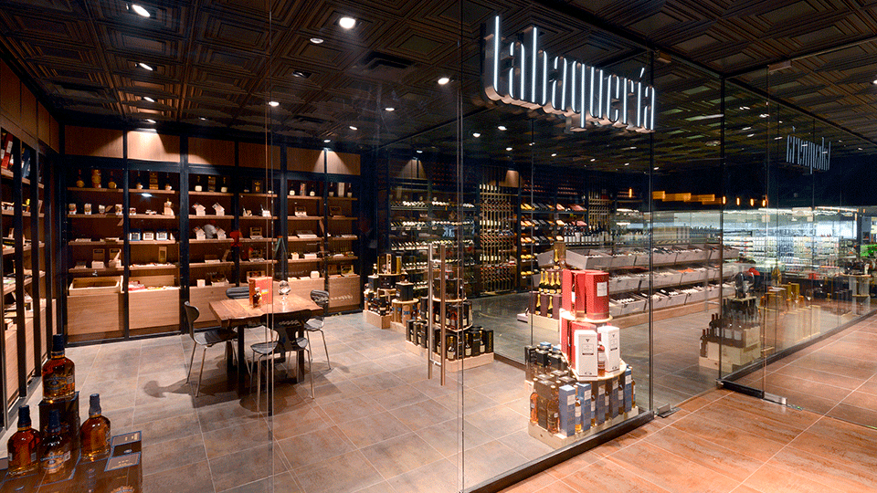 The cava area is made up of three different glass-enclosed spaces—one for high-end wines, another one is a humidor room for cigars and the last one for sommeliers classes and wine tasting. All of the spaces are treated with the same material and finishes that create a great wine buying experience.