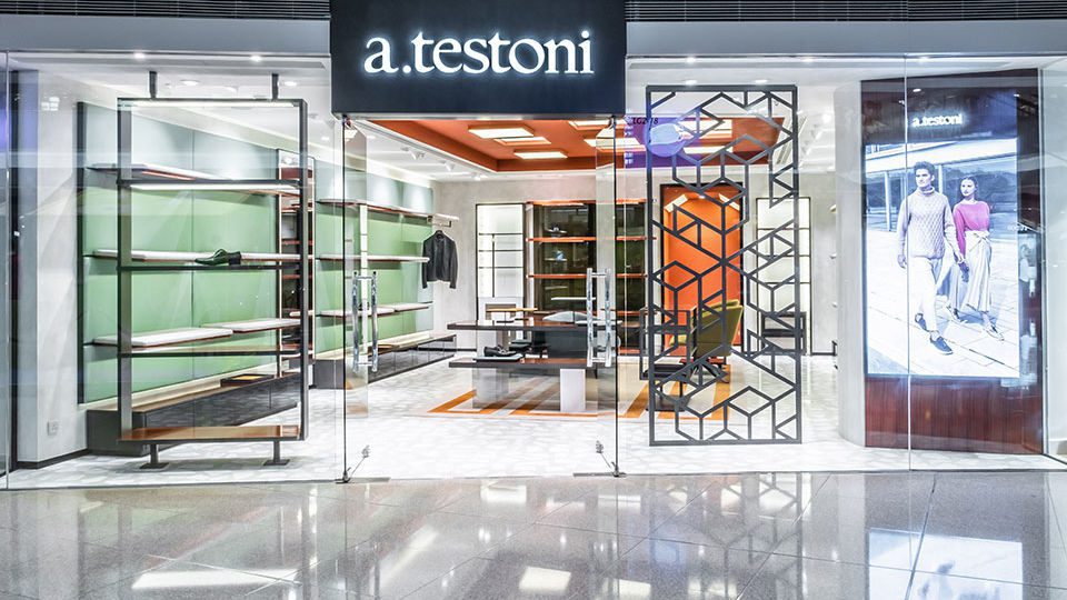 Stefano Tordiglione Design Ltd. (ST Design) created a colorful interior with geometric shapes to highlight the brand identity for a. testoni.