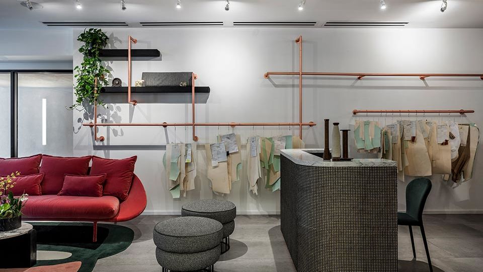 Furniture was imported from Portugal and Italy, including the pink marble coffee table, the copper piped lighting and the pink velvet sofa.