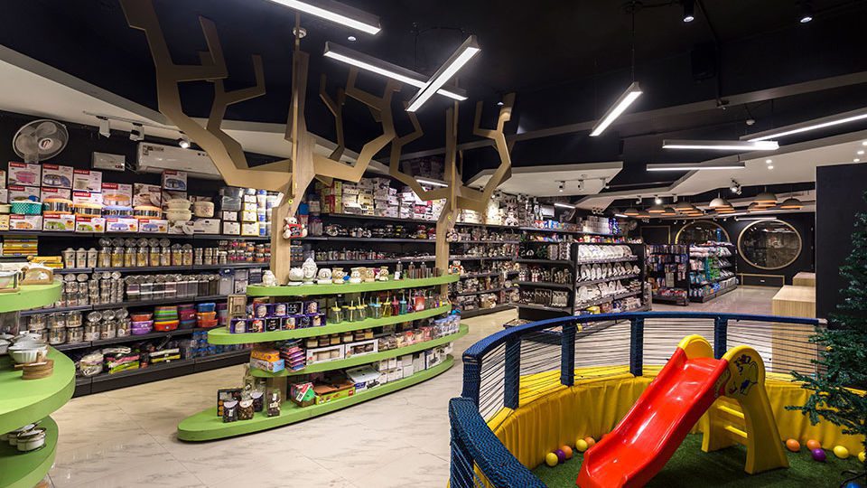 The lower level also features a children’s play area flanked by interesting fixtures inspired by trees.