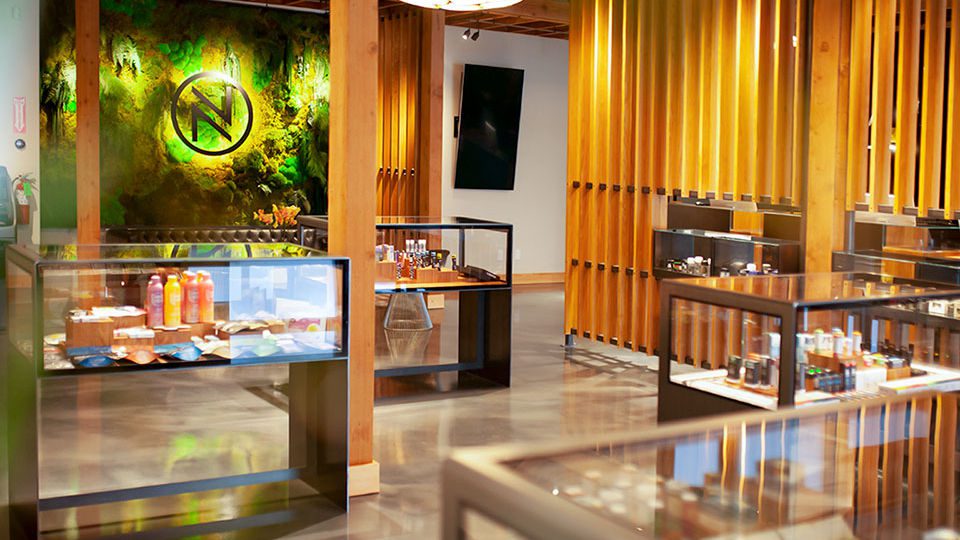 The screen wall and product cases were exclusively created by Chris French. For the floor, concrete was covered and restored by a permanent decorative epoxy flooring system. Alexander Design selected the depth of color, movement and finish for the floor to create a custom color and application process.