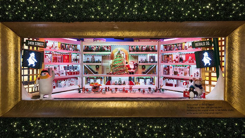 An adorable doll-house-like Macy’s Herald Square replica opens to reveal little animals in the store inside.