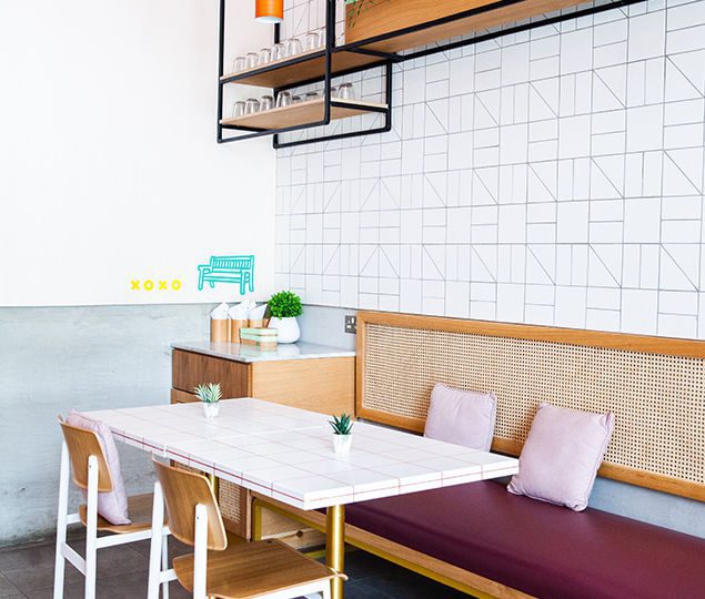 The venue is conceptually divided into two spaces: the workshop (open kitchen) and the playground—the restaurant area, depicting the recess scene at school, where groups of friends would congregate to catch up while enjoying a bit.