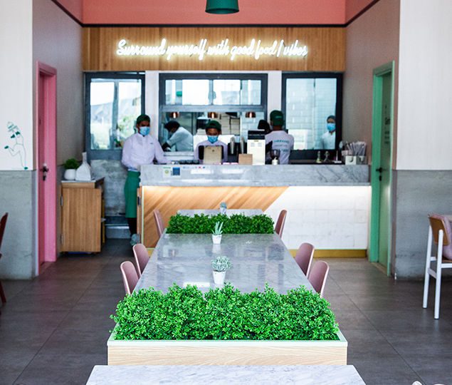 Carrara marble can be found on the entrance walls and communal tables which create an elevated feel for guests walking in.