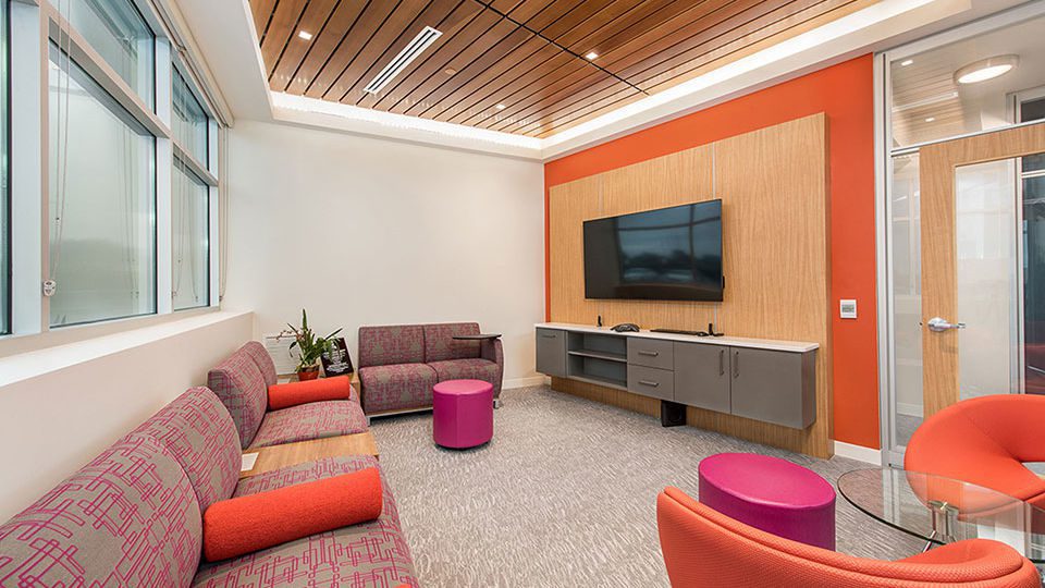 The “resi-mercial” inspired conference room is designed to create open conversation without the barrier of a conference table.