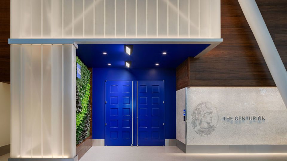 The new lounge experience features bold blue doors and a branded façade mosaic wall that was inspired by NYC subway murals.