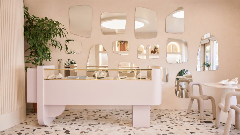 The space incorporates unexpected and playful design elements like these segmented mirrors.