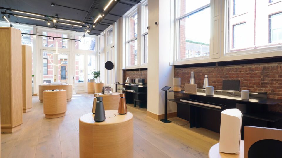 The team imported German wood flooring for the space. Exposed brick and sawtooth walls add dimension and texture to the store.