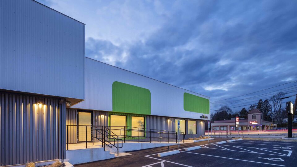 The main entry features new steps and an ADA-accessible ramp. A dedicated entrance assists with the need for a first interaction security checkpoint.