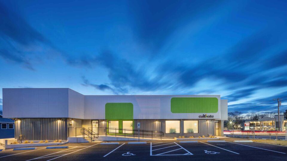 An exterior lighting scheme, coupled with interior lighting visible through the translucent windows, adds to the distinctive nature of the building.