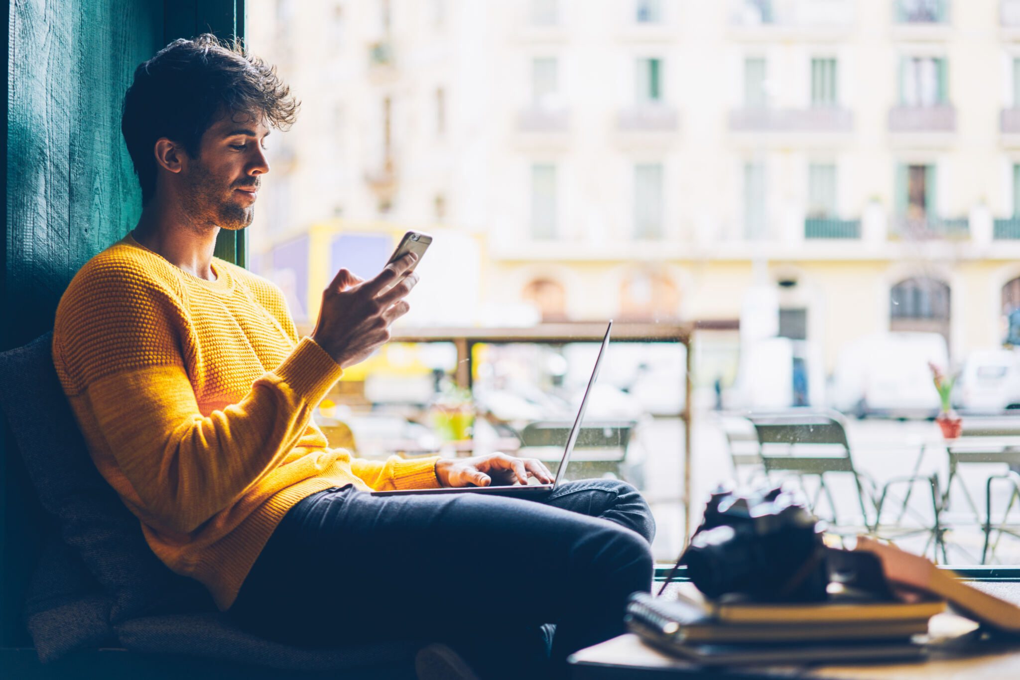 A young man using his smartphone to shop online