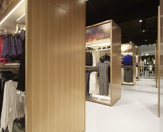 Taking inspiration from the layout of supermarket aisles, Landini Associates found that presenting merchandise in wardrobe-like display units actually created space for 50% more product on the sales floor. 