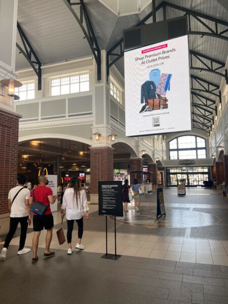 Shop Premium Outlets advertisement at a Premium Outlets location.