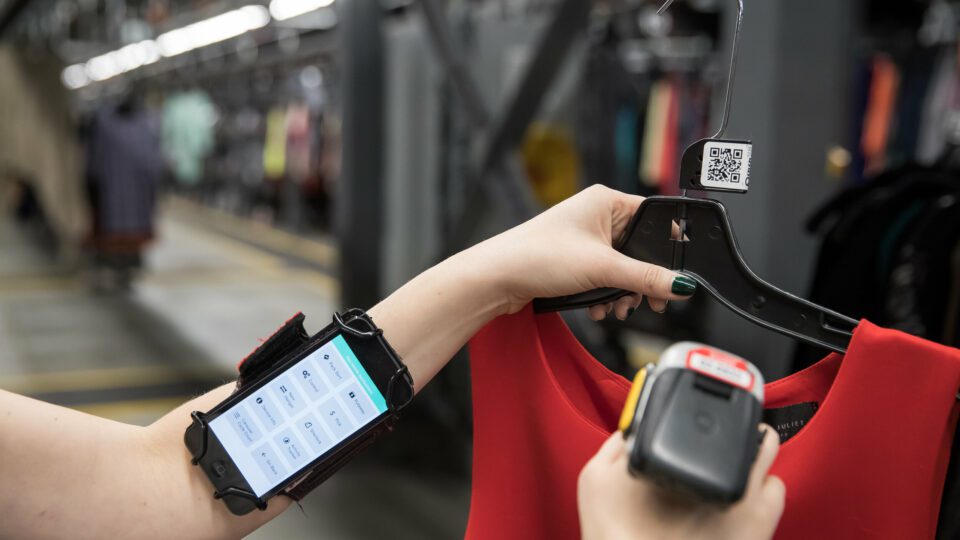 A ThredUp employee scans an item in a processing center.