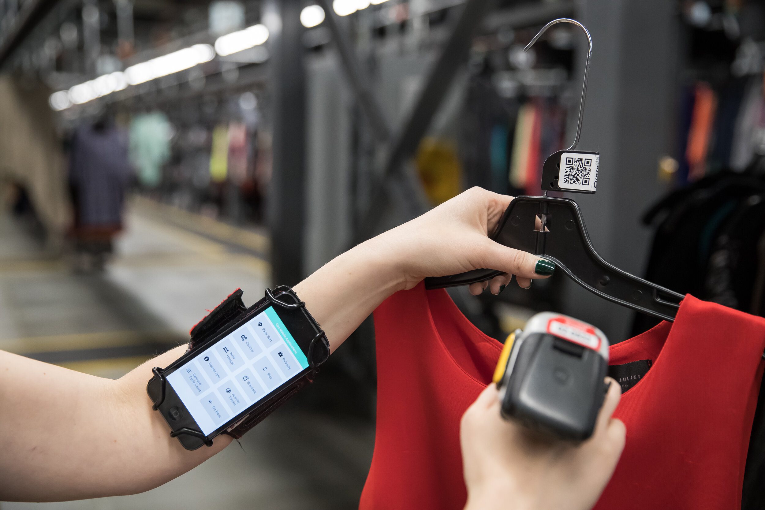 A ThredUp employee scans an item in a processing center.