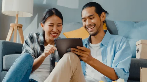 Couple working together on an ipad.