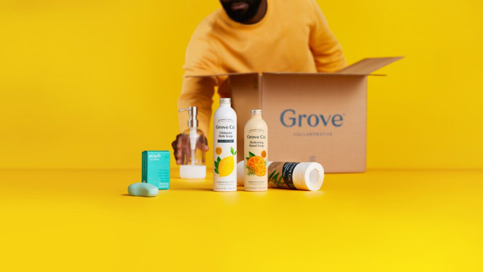 Man unpacks box from Grove Collaborative.