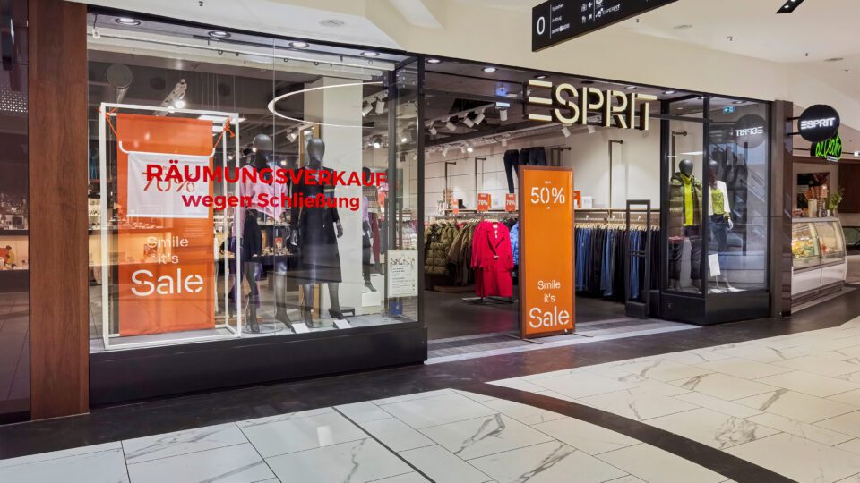 Esprit storefront with sale signs.