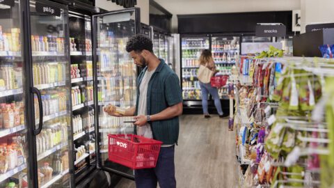Shoppers considers merchandise in a CVS.