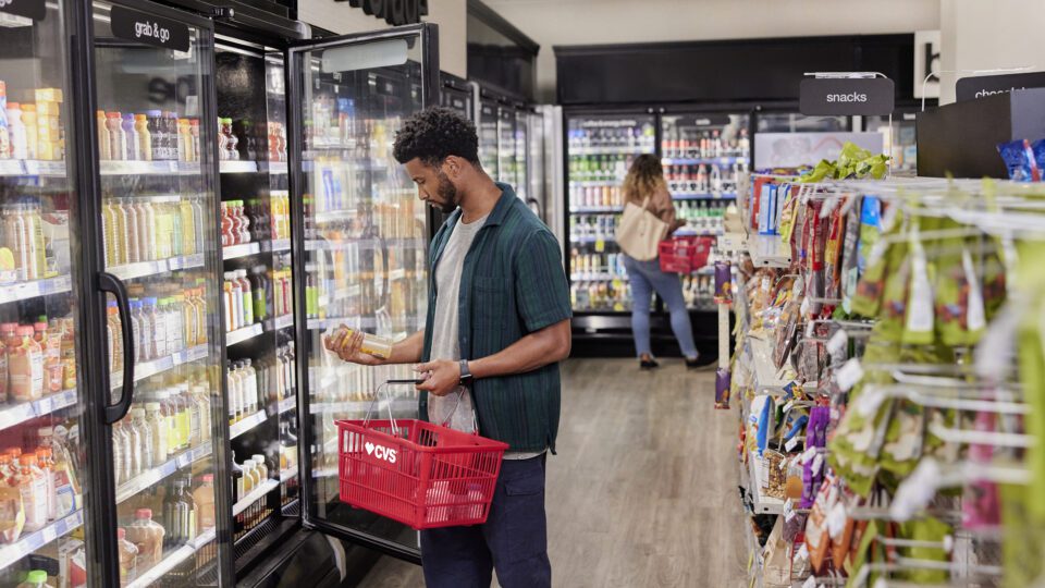 Shoppers considers merchandise in a CVS.