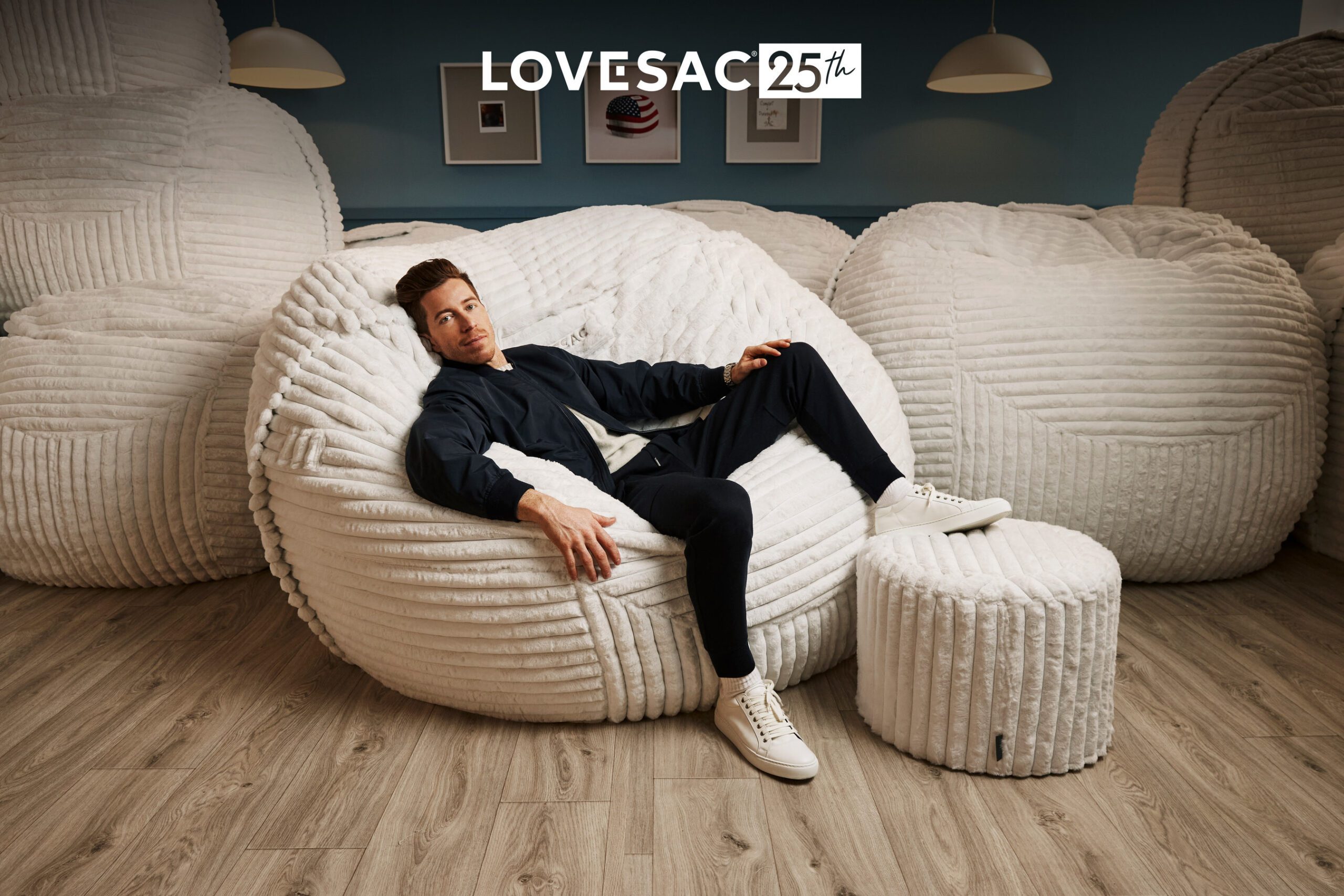 Olympic snowboarder Shaun White chills in the modern version of Lovesac's original beanbag chair.