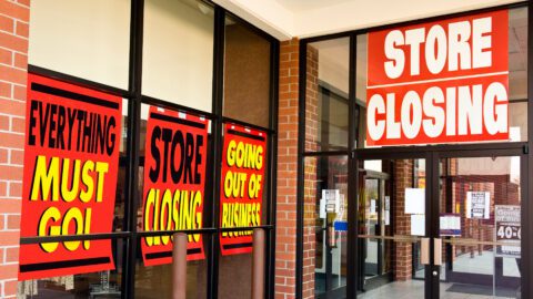Storefront with store closing signs.