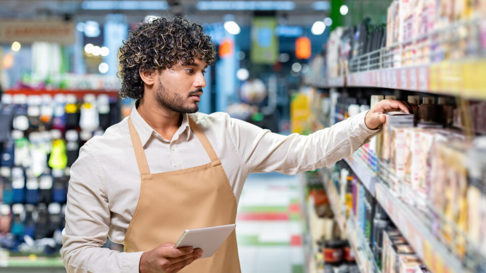 An employee uses a mobile tablet in store