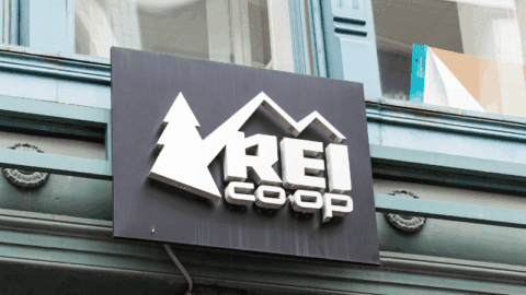 REI logo on storefront.