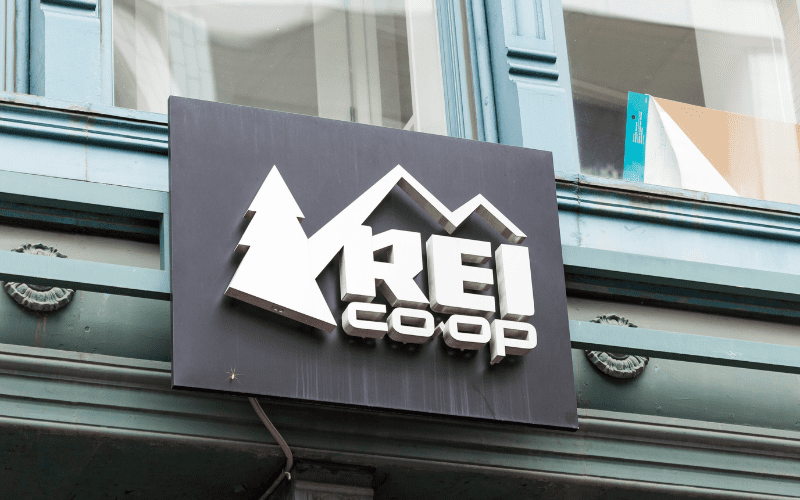 REI logo on storefront.
