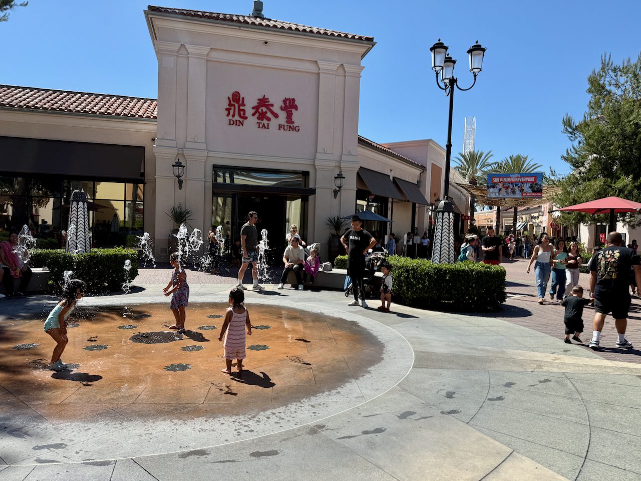 Families playing in the water feature outside dumpling destination Din Tai Fung on Father's Day at the Irvine Spectrum Center. Restaurants and kid-friendly features are a key part of the center's success. Photo by Retail TouchPoints. 